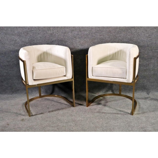 This pair of Mid-Century barrel side chairs beautifully combines timeless design with modern comfort, making them an...