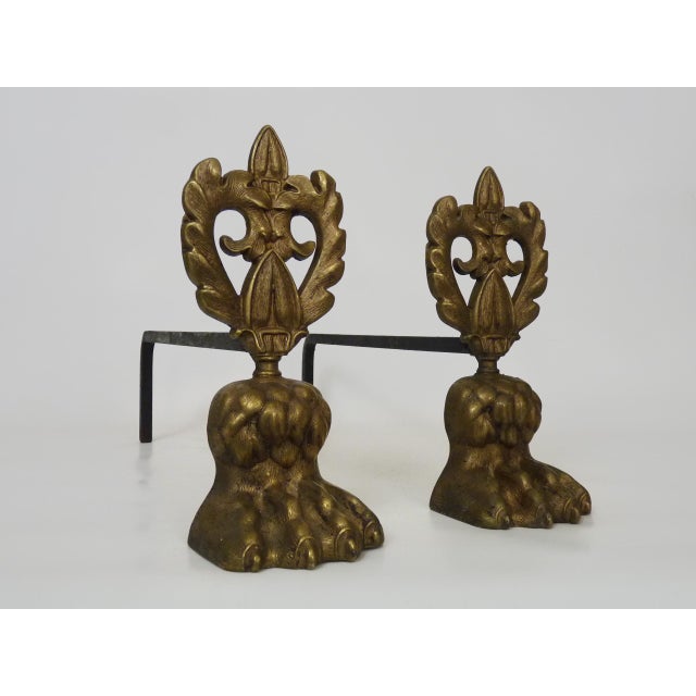 Pair of bronze andirons with lion's paw feet. Early 20th century A very fine pair of bronze andirons with beautiful lion's...