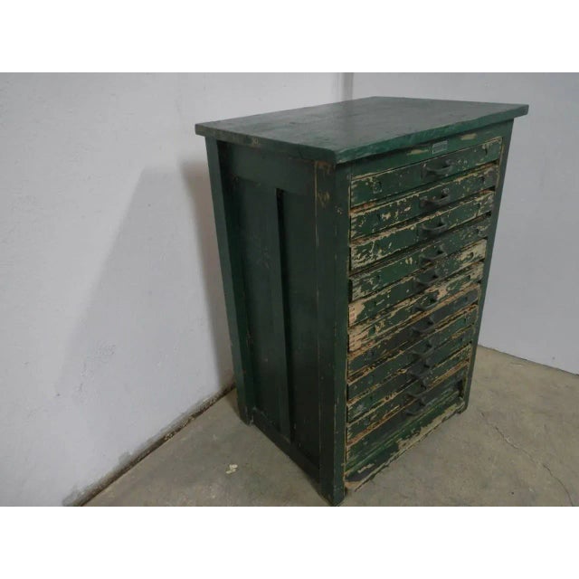 The desk is equipped with 11 drawers used to hold typefaces. This piece has an attribution mark, I am sure that it is...