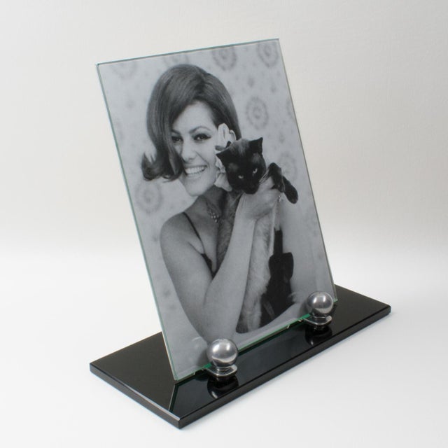 This lovely French Art Deco picture frame features a thick black opaline glass plinth complemented with two polished...