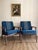 A handsome pair of Danish modern teak lounge chairs in the style of Hans Wegner, made in Denmark, circa 1960s. The chairs...