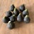 Beautiful and heavy, these vintage Italian alabaster figs, each a dark shade of black with a green top, look good enough...