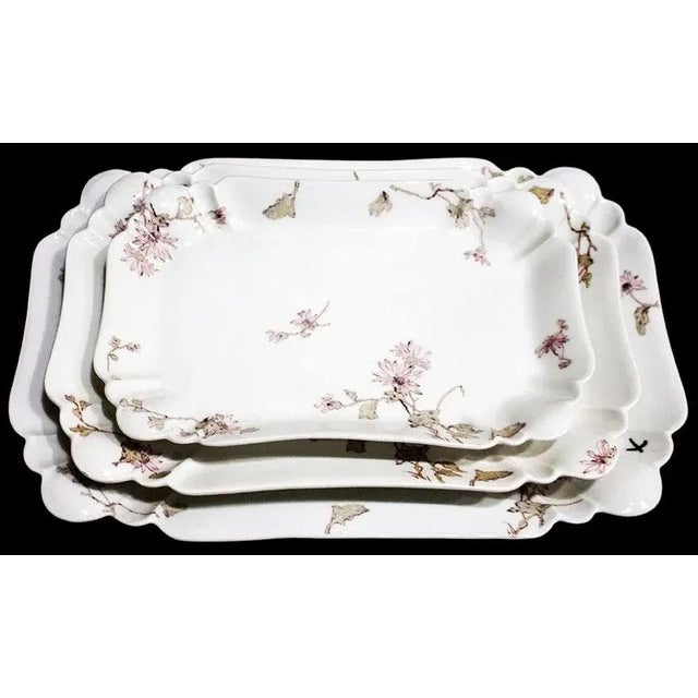 A spectacular and remarkably rare estate find, this complete three-piece suite of antique French porcelain graduated...