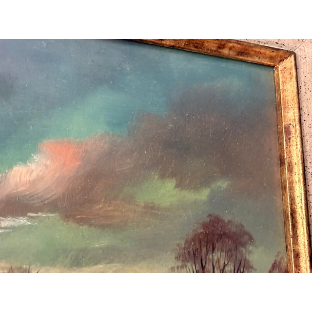 Charming vintage signed landscape painting depicting a quiet European countryside at sunset. A winding country road leads...