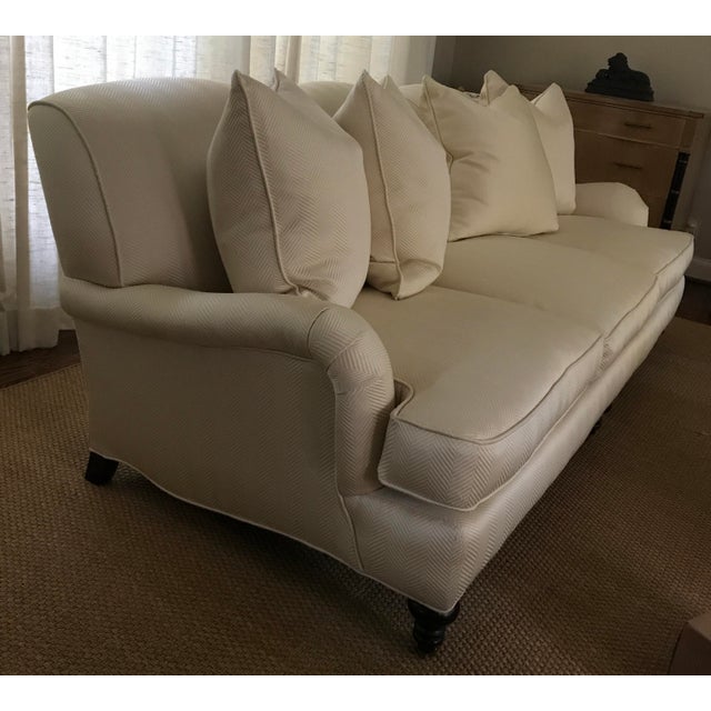 Herringbone, English arm, tight-back sofa, turned legs capped with brass casters. Includes four 22” goose-down throw...