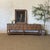 Crafted with reclaimed wood in a medium warm chestnut brown finish, this console will add a timeless look to any space....