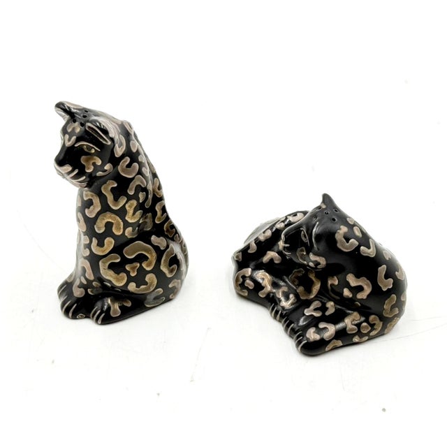 A rare and highly collectible pair of Emilia Castillo cheetah salt and pepper shakers, handcrafted in Mexico during the...