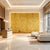 Luxury hand-painted chinoiserie mural set with warm mustard yellow background, delicately rendered with twisting flowering...