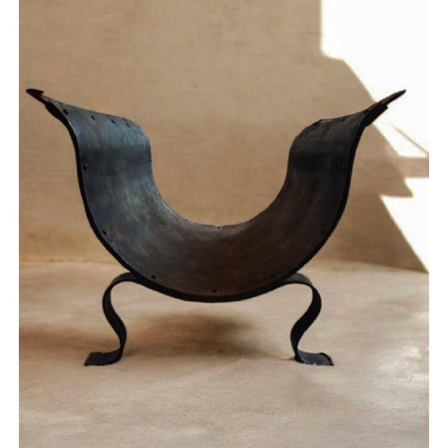 Elevate your living space with this exceptional piece of Mid-Century Spanish design. This striking coffee table features a...