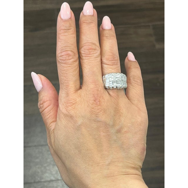 This exquisite ring is a stunning piece of fine jewelry that features a 3.48 carat baguette cut diamonds set in platinum....