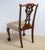 Set of six Chippendale style side dining chairs. Cabriole legs ending in ball and claw feet. Nail head trim. Intricately...