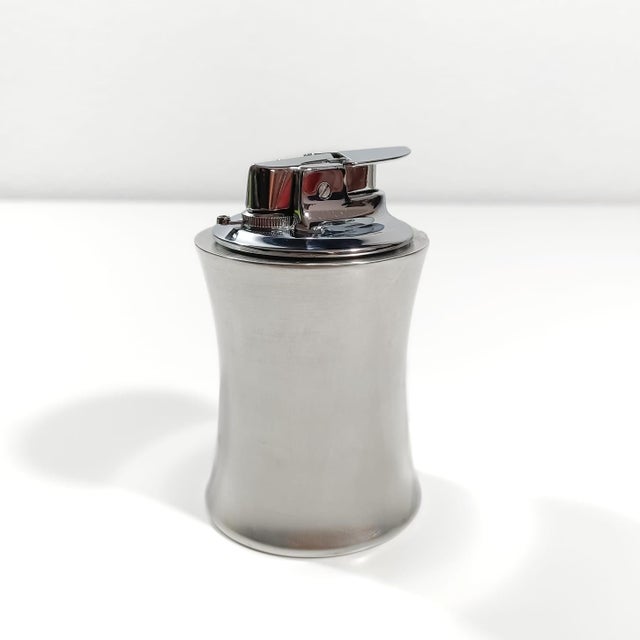 An extraordinary solid sterling silver table lighter by prestigious American silversmiths Shreve, Crump & Low, weighing a...