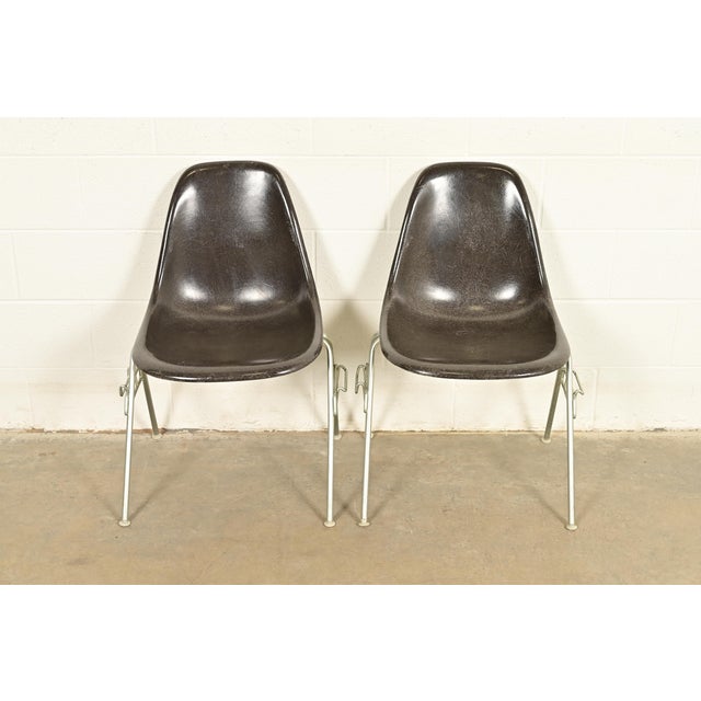 An iconic pair of Eames "DSS" shell side chairs, dining chairs, or office chairs By Charles & Ray Eames for Herman Miller...