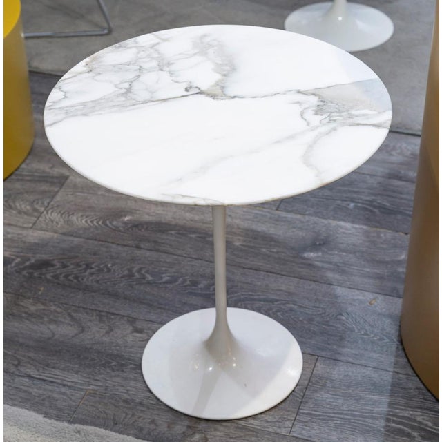 Eero saarinen (1910-1961), edition knoll: calacatta oro verde circular marble pedestal table, aluminum base covered with...