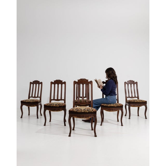 This piece presents as a piece, distinguished by dark wood, floral tapestry upholstery. Dating to 1900s and originating...