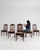 This piece presents as a piece, distinguished by dark wood, floral tapestry upholstery. Dating to 1900s and originating...
