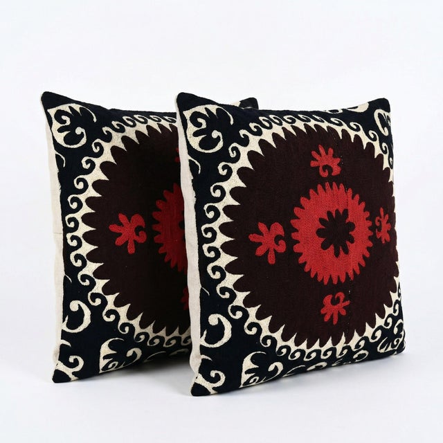 This beautiful 24'' x 24'' & 24'' x 25'' hand-embroidered Suzani pillow cover set was made from authentic Uzbek cotton...