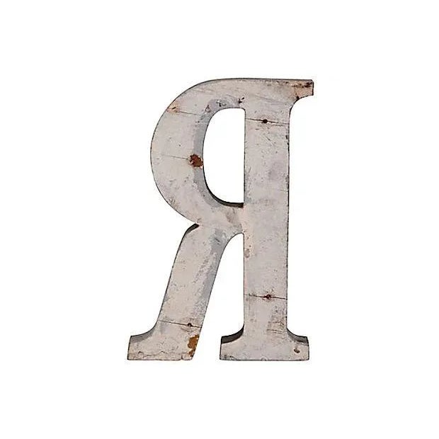 Vintage handmade wood letter R in original silver paint. Wear, discoloration, scratches, chips, holes.