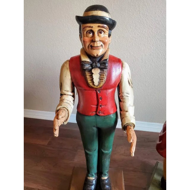 An interesting and whimsical Art Deco period hand carved and painted dumb waiter, this listing is for the butler statue...