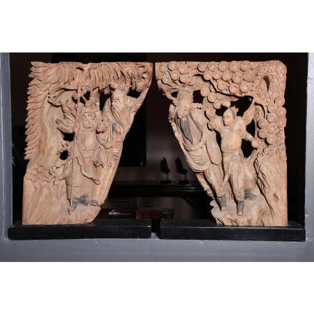 This 19th century pair of corbels from a temple comes from China, where it was hand-carved in wood during the Qing...