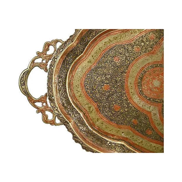 Large 23" oval antique brass tray with ornate handles and hand-engraved flora and vine design in hand painted red and...