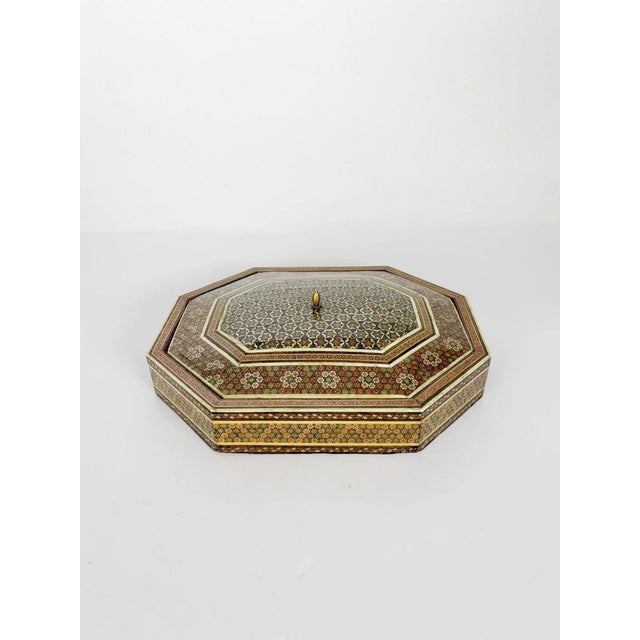 Large decorative wooden box dating from the 1970s, crafted in the Middle Eastern style and richly adorned with intricate...