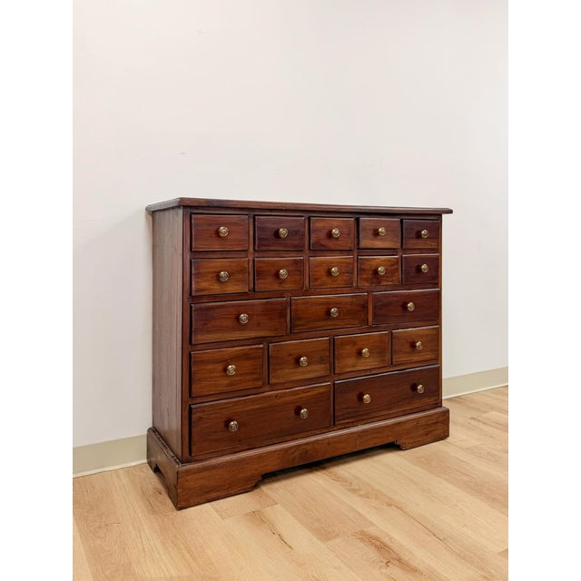 This wonderful handmade nineteen drawer apothecary cabinet is a genuinely rare and characterful storage find. The...