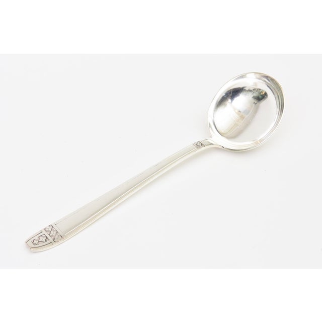 This lovely vintage heavy silver-plate large soup ladle or large serving spoon is between the Arts and Crafts movement and...