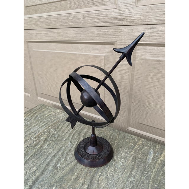 A beautifully crafted iron armillary sphere, evoking the timeless elegance of classical European gardens. Pieces like this...