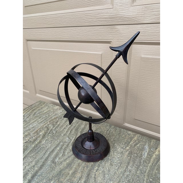 A stunning vintage English country or Neoclassical style bronze tone iron garden armillary sundial with Roman numerals...