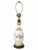 A charming vintage ceramic table lamp featuring a graceful urn-shaped silhouette, delicate floral decoration, and soft...