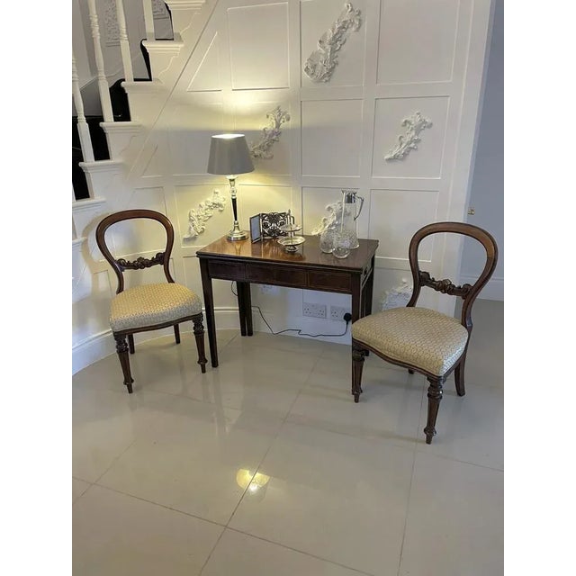 Antique george iii quality mahogany inlaid tea table having a quality mahogany fold over top supported by two swing out...