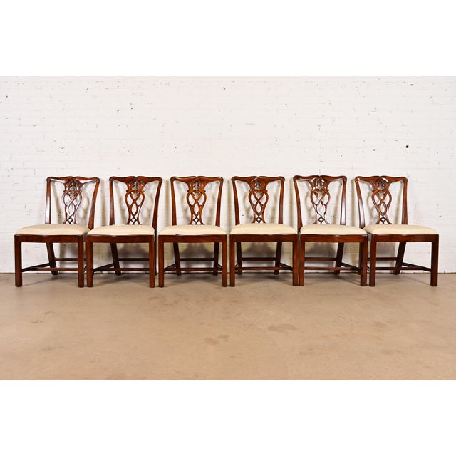 A gorgeous set of six Georgian or Chippendale style dining chairs By Maitland Smith Late 20th Century Carved mahogany...