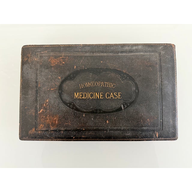 This is a striking late 19th-century English homeopathic medicine case, nicely preserved in its original leather covering,...