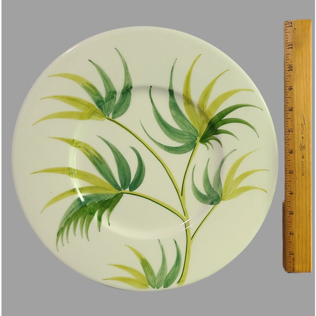 Add a touch of the tropics to your dining table with this beautiful Bergdorf Goodman platter. The 13'' round platter...