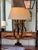 Vintage Italian lamp carved as a lyre in ebonized wood picked out with gilt. Two arms curve up from a gilt cartouche to...