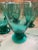 Here we have a set of eight gorgeous teal footed drinking glasses. Each holds 12 oz. to the very rim and 10 ounces...