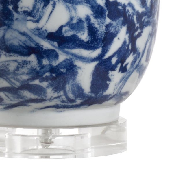 Abstract marble pattern in blue and white on ceramic with a clear crystal mounting. 31h x 5.5w x 5.5d Shade Dimensions:...