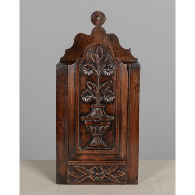 A 19th century French fariniere, made of walnut with nicely detailed hand-carved floral relief on front panel. Good...
