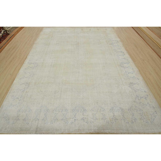 An authentic vintage traditional Kerman rug hand-knotted with fine wool and natural dyes. This oriental rug features a...