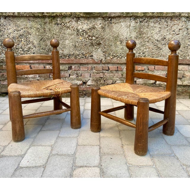 Beautiful pair of low wooden chairs attributed to Charles Dudouyt, a key figure of French design from the 1930s–1950s....