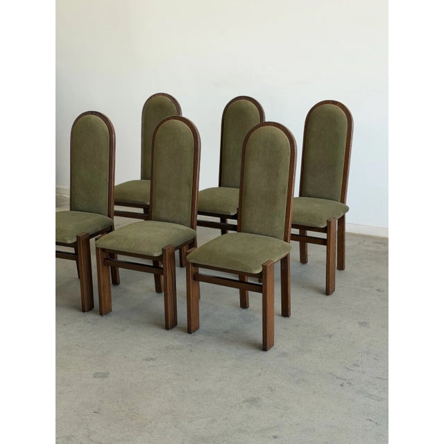 W19 D24 H42 SW16 SD17 SH19.5 These sculptural dining chairs are crafted from solid oak and feature a tall, softly arched...