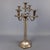Large, five-branched candelabra in silver-plated metal, classic style. It features a hexagonal base and a sturdy central...