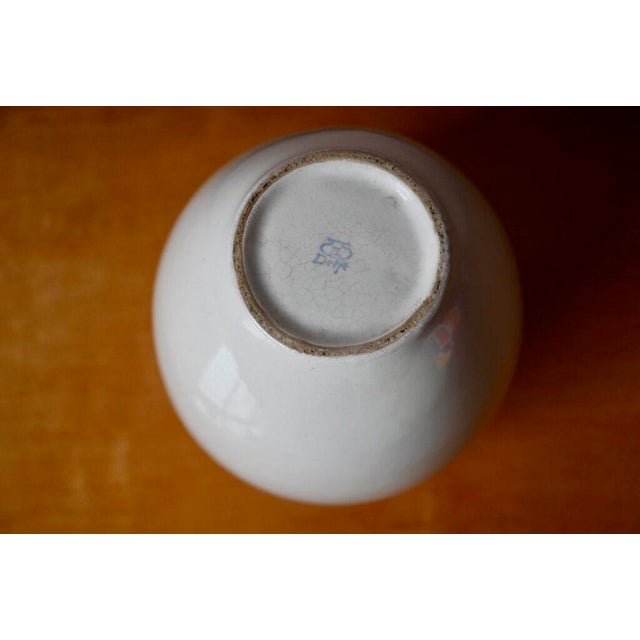 This lovely white porcelain vase is a Dutch production by Thooft & Labouchere in Delft. with its understated elegance, it...