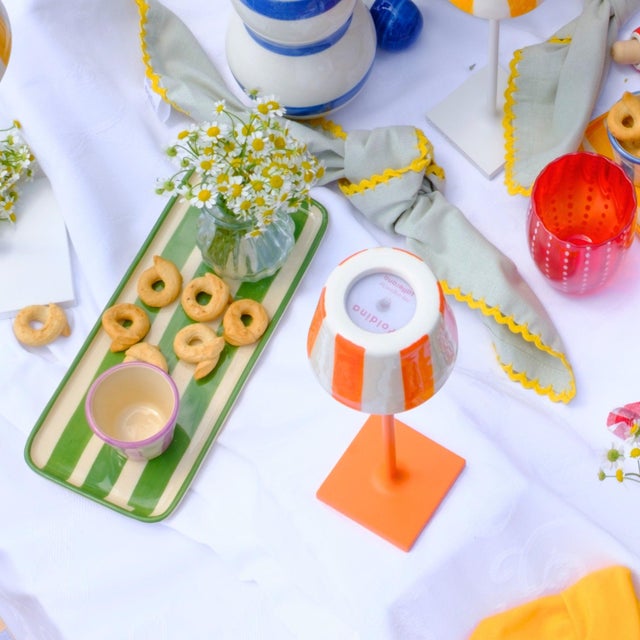 Hand-painted ceramic stoneware collection crafted in a historic factory in Civita Castellana Italy, a village where...