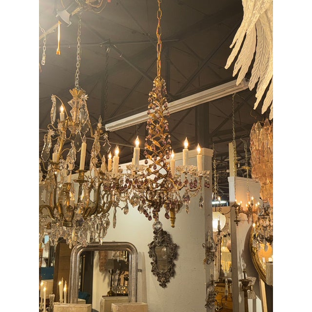 This Italian beaded crystal and amethyst chandelier is a luxurious and elegant lighting fixture designed to add a touch of...
