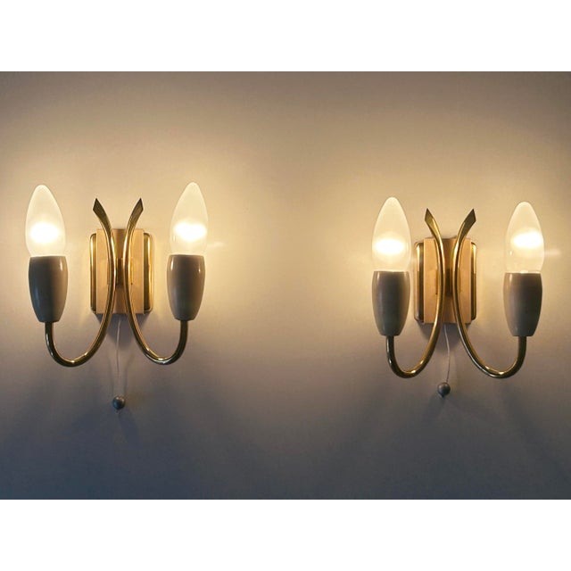 Set of two rare, lovely and highly decorative mid-century modern sputnik sconces or wall fixtures. Designed and...