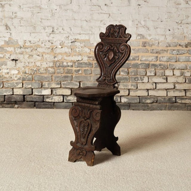 Add bold architectural character to your space with this early 20th century French oak Gothic style chair, a striking...