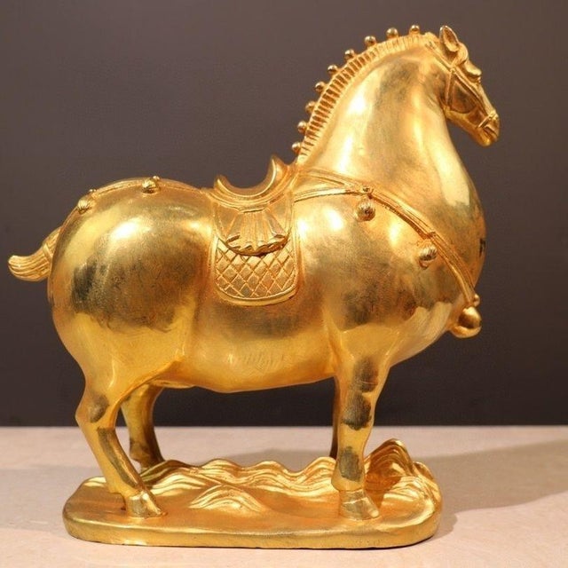 This is a striking vintage Chinese gilt bronze horse figure, modeled after the classic Tang dynasty style. The horse...