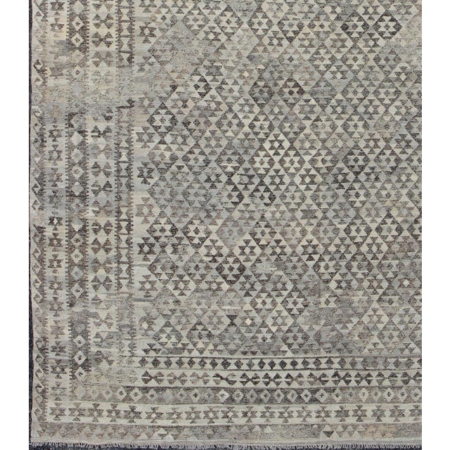 This hand-woven Afghan kilim rug features a beautiful diamond geometric design Measures: 10'0 x 13'0 Afghan Modern Kilim,...